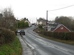 The road through Broughton Cross (geograph 4248128).jpg
