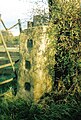 The opposing stile gatepost with square concavities