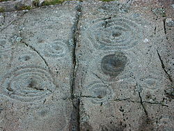 Cup and Ring markings on inscribed stone.jpg
