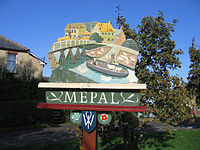 Village sign, with Cornelius Vermuyden's wooden bridge and sheep aboard a boat
