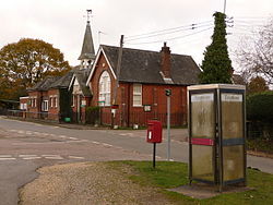 Hyde- postbox № SP6 122 and phone - geograph.org.uk - 2171247.jpg