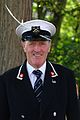 Swan marker of the Worshipful Company of Vintners, in his blue uniform, during annual swan upping, Abingdon, summer 2011