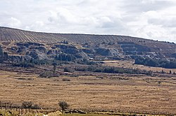 heathland with quarries beyond and mountain behind