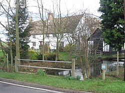 Attractive cottage beside stream in Whaddon - geograph.org.uk - 344172.jpg